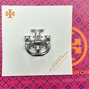 New never used Tory Burch phone ring silver color